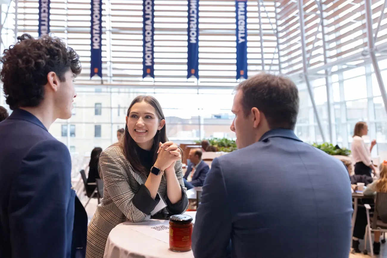 People taking to each other at a table.